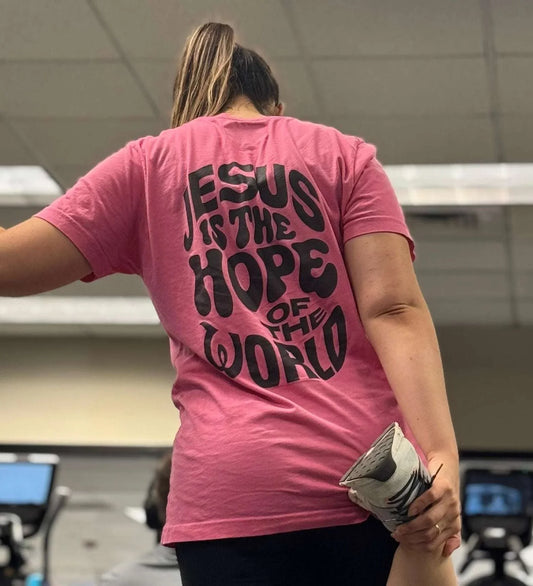 Pink t-shirt with the message "Jesus is the Hope of the World" in bold lettering