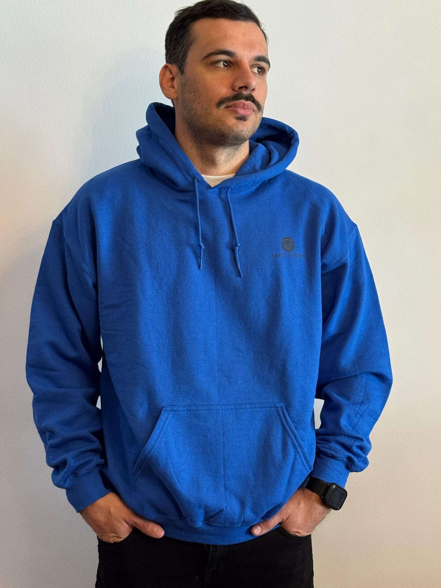 Man wearing a blue hoodie against a plain background