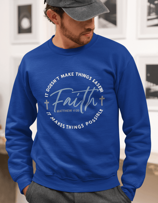 Man wearing a blue sweatshirt with motivational text in an indoor setting